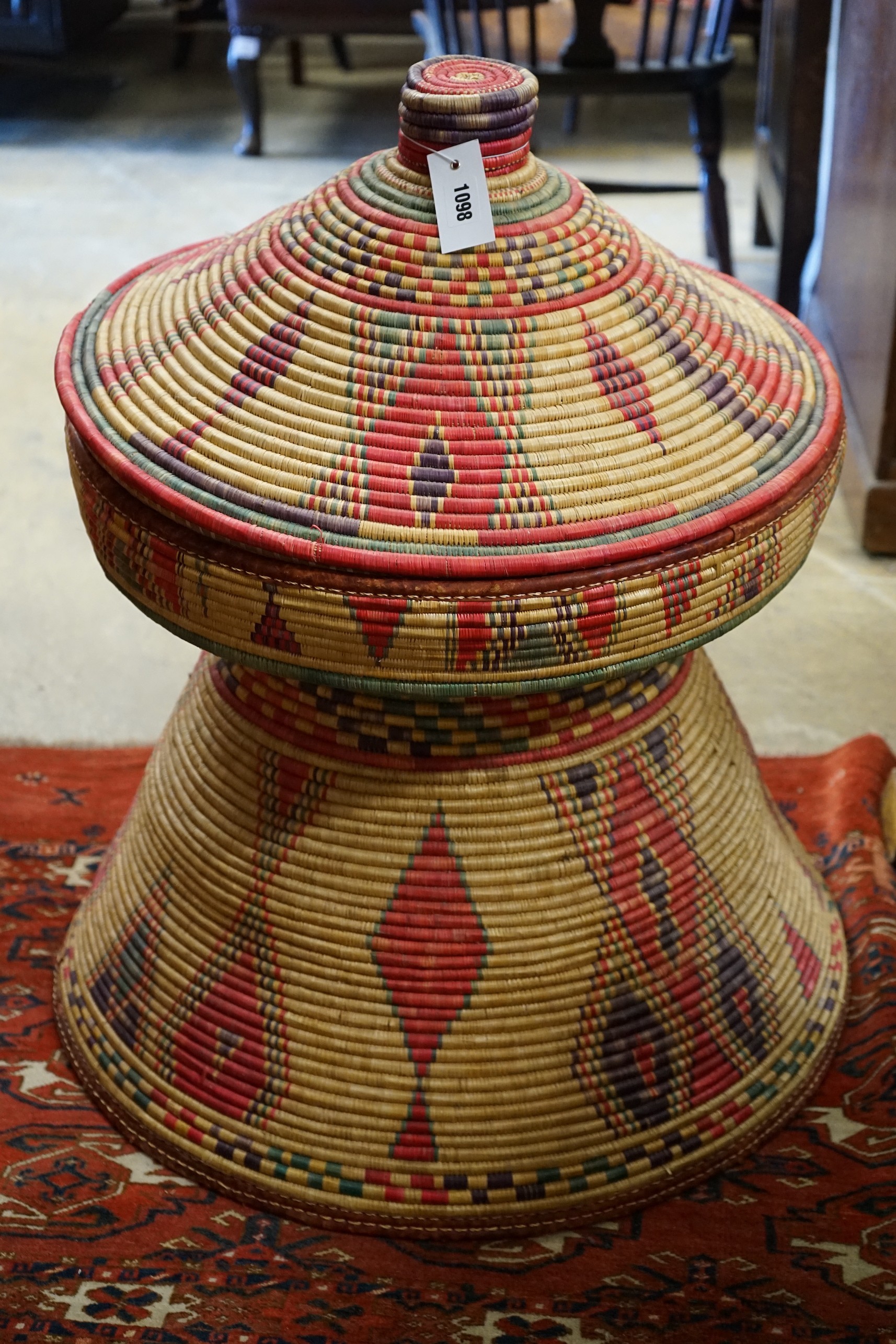 A large African woven basket, height 76cm